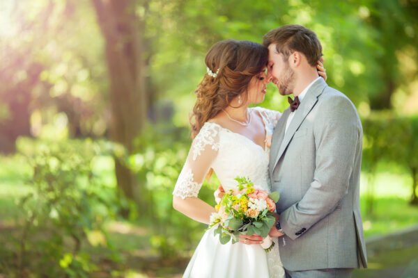 Happy bride and groom at a park on their Duluth wedding day