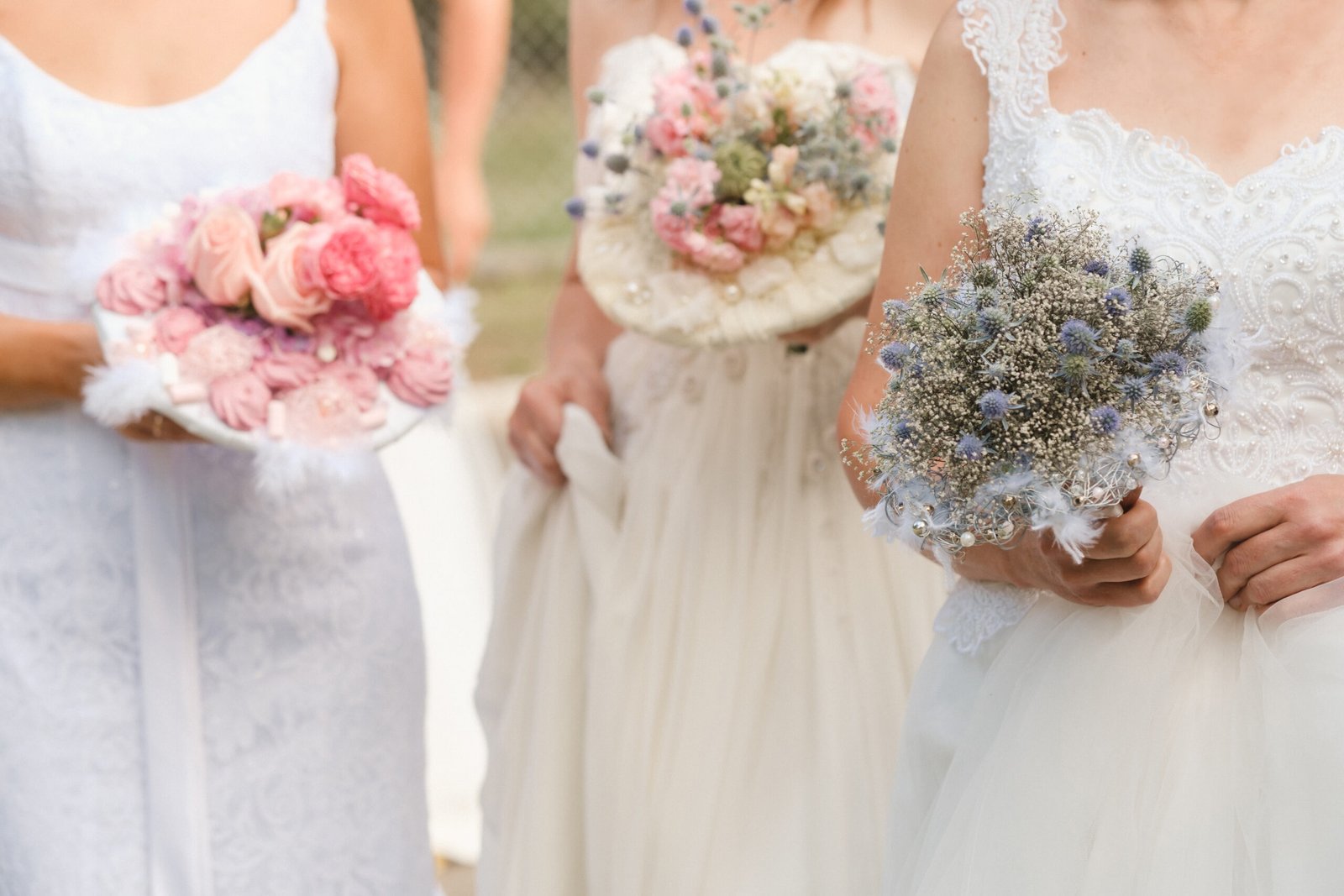 Several brides holding wedding bouquets, representing vendor comparison