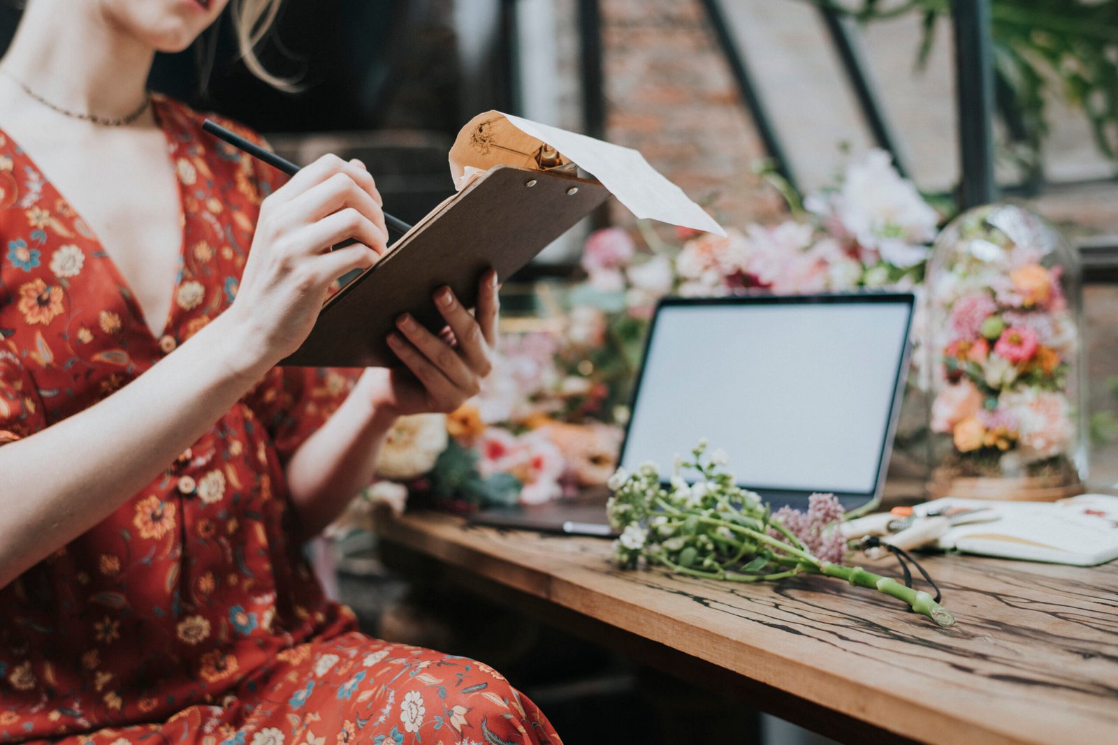Couple taking notes while comparing Duluth wedding vendors